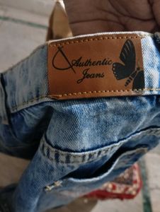 Distressed Denim Jeans with Floral Appliques