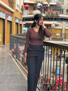 brown top and Black Trousers both