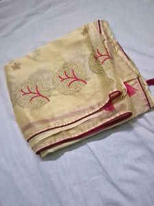 cream color embroidery saree