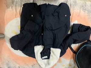 Black Puffer Jacket Had Adjustable Knot At The