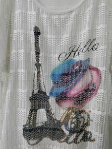 Eiffel Tower Graphic Top with Shiny Earrings.