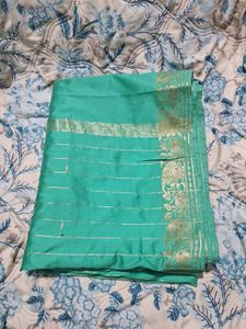 Beautiful Teal Saree with Gold Border
