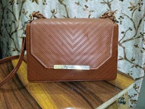 Chic Brown Crossbody Bag with Perforated Design
