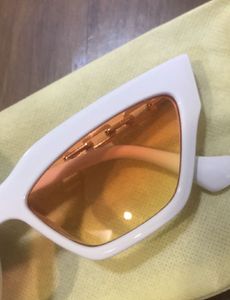 White Cat-Eye Sunglasses with Orange Lenses