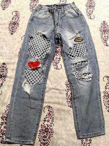 Distressed Ripped Jeans with Fishnet Detail