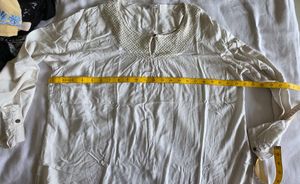 Elegant White Top with Textured Yoke