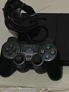 PS2 Console With 11 CD's (Non Working)