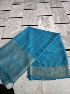 Elegant Teal Saree with Embellished Border
