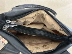Chic Floral Handbag with Black Accents