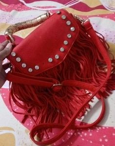 Chic Red Handbag with Gold Accent Handle