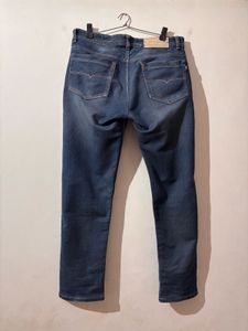 Distressed Blue Denim Jeans