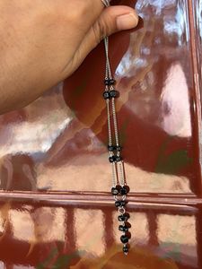 Elegant Silver Necklace with Black Beads