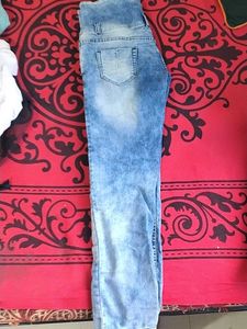 39.Distressed High-Waisted Blue Jeans
