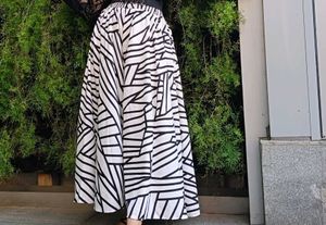 Flared white,black Geometric Print trousers