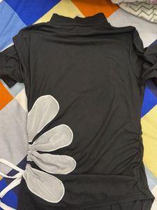 Chic Black Ruched Top with Floral Detail