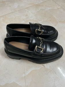 Classic Black Loafers with Gold Buckle