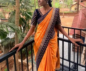 Elegant Orange Saree with Navy Blue Blouse