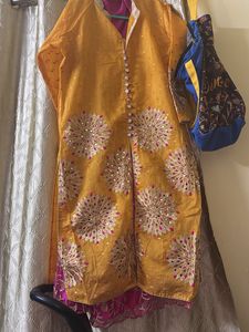 Elegant Yellow Kurta with Pink Accents