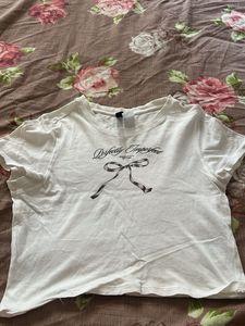 Chic White Graphic Tee with Bow Detail