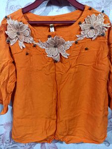 Vibrant Orange Kurta with Floral Embellishments