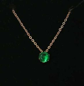Elegant Gold Chain with Emerald Pendant