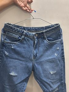 Distressed Blue Denim Jeans