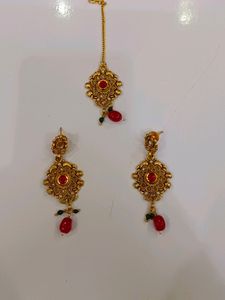 Gold Earrings With Mangtika In Red Stone