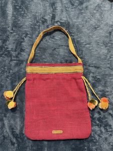 Embroidered Potli Bag with Pom Poms