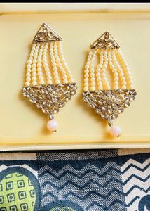 heavy gold and pearl earrings