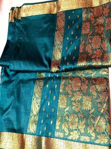 Elegant Teal Saree with Gold Paisley Border