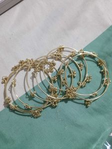 set of 8 Delicate Golden Bangles with Bell Charms