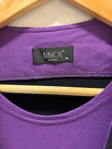 Goth Vest Over Purple Tee