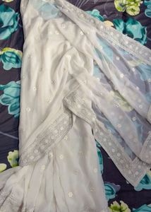 Elegant White Saree with Silver Embellishments