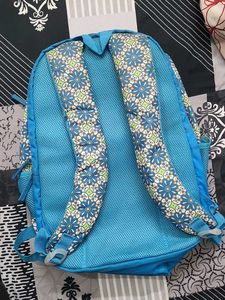 Blue Backpack with Floral Pattern