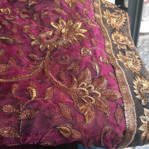 Silk type maroon saree with golden embroidery and