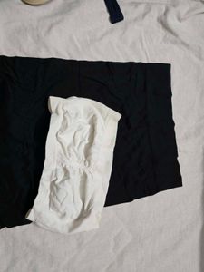 Black camisole and white tube bra
