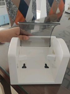 white tissue holder with flat storage on top