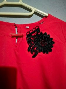 Elegant Red Top with Black Lace Accent