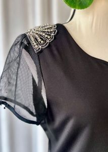 Chic Black Dress with Sheer Sleeves