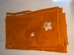Vibrant Orange Saree with Embellishments