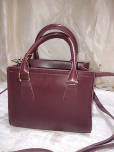Elegant Maroon Handbag with Shoulder Strap