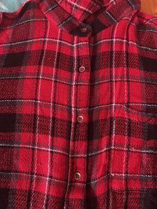 Red and black plaid flannel shirt.