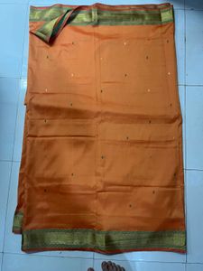 Orange Silk Saree with Gold Border