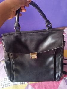 black handbag cum backpack style bag.