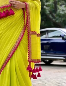 Elegant Yellow Saree with Red Border