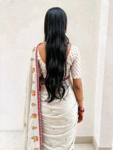 Elegant White Saree with Peacock Motifs