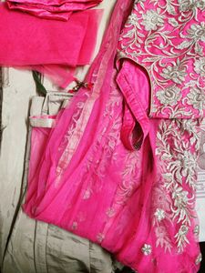 A Beautiful Pinkish Gown With Golden Work