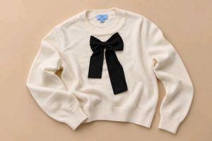 IVORY SWEATER WITH BLACK BOW