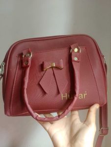 Chic Burgundy Handbag with Bow Accent