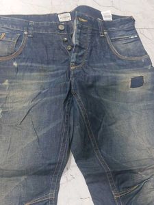 Distressed Blue Denim Jeans